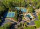 Aerial view of a community pool, clubhouse, and tennis courts at 701 Vinings Estates Se Dr, Smyrna, GA 30126