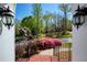View from front entrance looking out to mature trees, shrubs, and neighbor's home at 701 Vinings Estates Se Dr, Smyrna, GA 30126