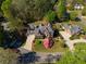 Aerial view of a beautiful two-story home with manicured landscaping and a circular driveway at 701 Vinings Estates Se Dr, Smyrna, GA 30126