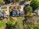 Aerial view showcasing the home's backyard, deck, and landscaping at 701 Vinings Estates Se Dr, Smyrna, GA 30126