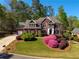 Beautiful brick home with manicured lawn and attached three car garage at 701 Vinings Estates Se Dr, Smyrna, GA 30126