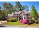Beautiful brick home with a manicured lawn and mature landscaping at 701 Vinings Estates Se Dr, Smyrna, GA 30126