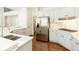Kitchen featuring stainless appliances, stone countertop, and stylish cabinetry at 701 Vinings Estates Se Dr, Smyrna, GA 30126