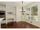 Sunny kitchen with stainless steel appliances, custom cabinetry, and eat-in breakfast nook at 701 Vinings Estates Se Dr, Smyrna, GA 30126