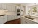 Kitchen with stainless steel appliances, white cabinets, and light countertops at 701 Vinings Estates Se Dr, Smyrna, GA 30126