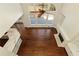 Bright living room featuring hardwood floors, fireplace, and large windows with natural light at 701 Vinings Estates Se Dr, Smyrna, GA 30126