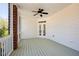 Inviting screened porch with ceiling fan and access to the outdoors via double doors at 701 Vinings Estates Se Dr, Smyrna, GA 30126