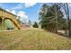 Landscaped backyard offering privacy and green space at 153 Oak St, Hiram, GA 30141