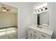 Bathroom with white vanity, quartz countertop, and view of bedroom at 153 Oak St, Hiram, GA 30141