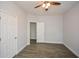 Spacious bedroom with ceiling fan and wood-look floors at 153 Oak St, Hiram, GA 30141