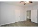Spacious bedroom with ceiling fan and wood-look floors at 153 Oak St, Hiram, GA 30141