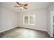 Spacious bedroom with ceiling fan and hardwood floors at 153 Oak St, Hiram, GA 30141