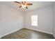 Spacious bedroom with ceiling fan and wood-look floors at 153 Oak St, Hiram, GA 30141