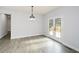 Bright dining room features hardwood floors and access to deck at 153 Oak St, Hiram, GA 30141