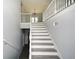 Grey and white staircase with a loft area overlooking the main floor at 153 Oak St, Hiram, GA 30141