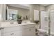 Bathroom boasts double vanity, large mirror, and a walk-in shower at 2096 Moss Hill Road, Stone Mountain, GA 30088