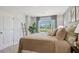 Bright bedroom with large window, plush bedding, and ample natural light at 2096 Moss Hill Road, Stone Mountain, GA 30088