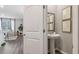 Chic powder room with pedestal sink, modern art, and stylish decor at 2096 Moss Hill Road, Stone Mountain, GA 30088