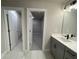 This bathroom features a double vanity, modern fixtures, and walk-in closet at 391 Lincoln St, Woodstock, GA 30188