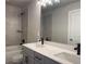 This bathroom offers a double sink vanity, modern fixtures, a shower, and a bathtub at 391 Lincoln St, Woodstock, GA 30188