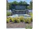 Community entrance featuring stone pillars, water feature, and attractive landscaping, welcomes residents and guests at 391 Lincoln St, Woodstock, GA 30188