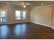 Open-concept living area featuring hardwood floors, recessed lighting, and access to an outdoor balcony at 391 Lincoln St, Woodstock, GA 30188