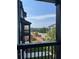 View from covered patio overlooking neighborhood and distant mountains at 391 Lincoln St, Woodstock, GA 30188