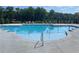 Resort-style pool with many lounge chairs with an expansive sundeck, perfect for relaxation at 391 Lincoln St, Woodstock, GA 30188