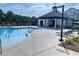 Enjoy the community pool, complete with tables, chairs, lounge chairs, and a pool house at 391 Lincoln St, Woodstock, GA 30188