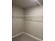 This walk-in closet is equipped with adjustable shelving for optimal storage at 391 Lincoln St, Woodstock, GA 30188