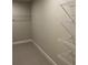 This walk-in closet is equipped with adjustable shelving for optimal storage at 391 Lincoln St, Woodstock, GA 30188