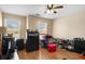 Bedroom with hardwood floors, ceiling fan, and ample closet space at 3111 Green Gate Se Way, Conyers, GA 30013