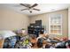 Bedroom with hardwood floors and ceiling fan at 3111 Green Gate Se Way, Conyers, GA 30013
