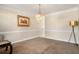 Spacious dining room featuring a large chandelier at 3111 Green Gate Se Way, Conyers, GA 30013