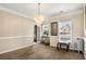 Bright dining room with chandelier and hardwood floors at 3111 Green Gate Se Way, Conyers, GA 30013