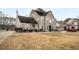 Two-story brick home with a large driveway and side yard at 3111 Green Gate Se Way, Conyers, GA 30013
