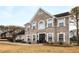 Two-story brick home with a large front yard and landscaping at 3111 Green Gate Se Way, Conyers, GA 30013