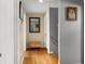 Upstairs hallway with hardwood floors and neutral walls at 3111 Green Gate Se Way, Conyers, GA 30013