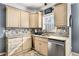Kitchen features light beige cabinets and a granite countertop at 3111 Green Gate Se Way, Conyers, GA 30013