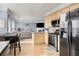 Open concept kitchen with island and view into living room at 3111 Green Gate Se Way, Conyers, GA 30013