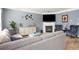 Spacious living room with a fireplace and large windows at 3111 Green Gate Se Way, Conyers, GA 30013