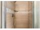 Shower stall with hexagon and wood-look tile at 3111 Green Gate Se Way, Conyers, GA 30013