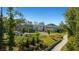 Walking path with lush landscaping, leading to community buildings at 500 Clover Ln, Alpharetta, GA 30009