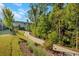 Curving community path surrounded by trees and greenery at 500 Clover Ln, Alpharetta, GA 30009