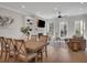 Light-filled dining room with wooden table and chairs, adjacent to the living room at 500 Clover Ln, Alpharetta, GA 30009