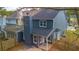 Back exterior view of a home with a private backyard at 8045 Woodlake Dr, Riverdale, GA 30274