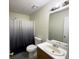Standard bathroom with shower, toilet, vanity, and neutral color scheme at 8045 Woodlake Dr, Riverdale, GA 30274