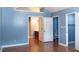 Spacious bedroom with vaulted ceiling and access to a full bathroom at 8045 Woodlake Dr, Riverdale, GA 30274