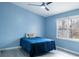 Cozy bedroom with ample natural light from a large window at 8045 Woodlake Dr, Riverdale, GA 30274