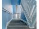 Staircase features modern design and leads to upper levels of the home at 8045 Woodlake Dr, Riverdale, GA 30274